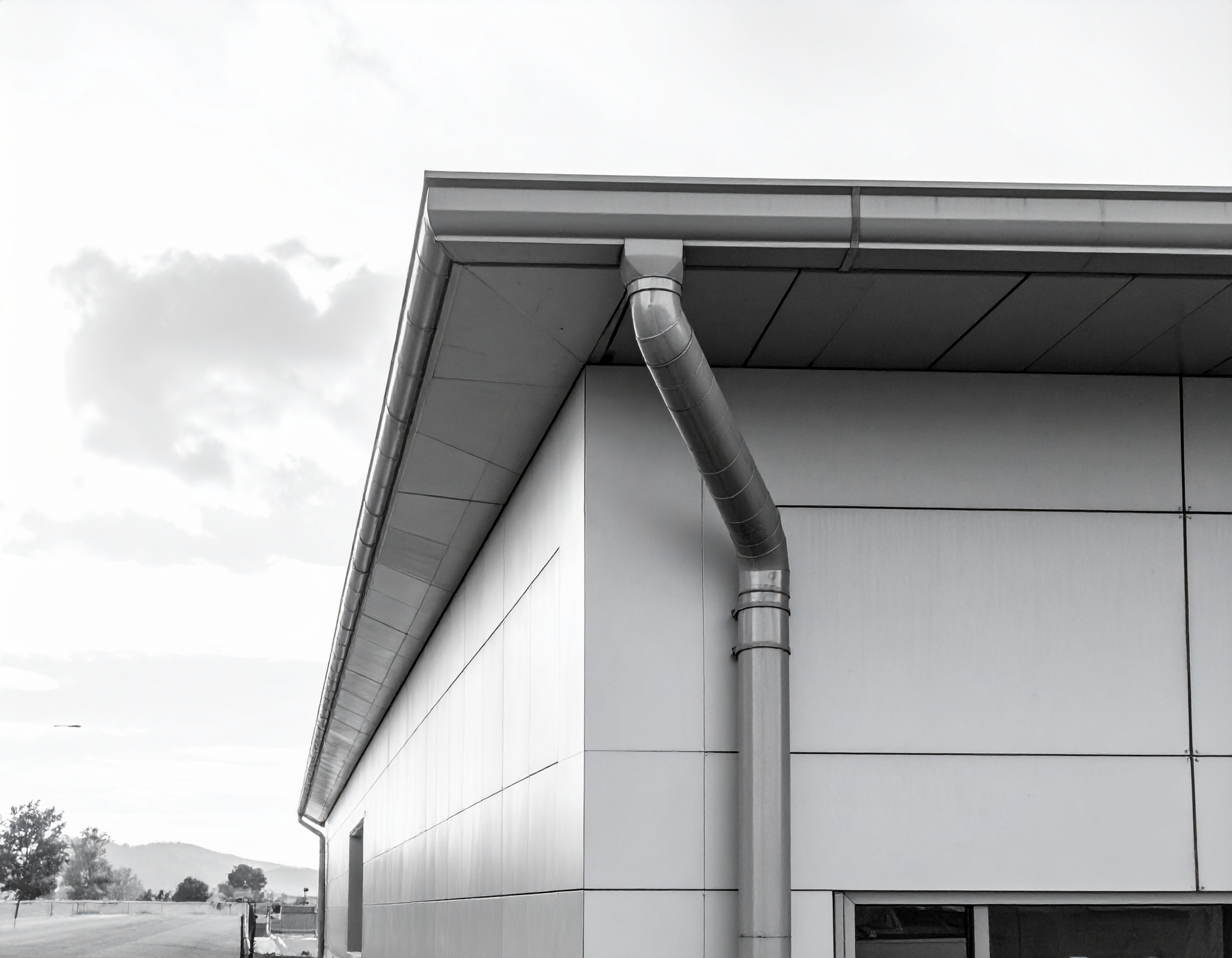 High-capacity commercial gutter system on a commercial building